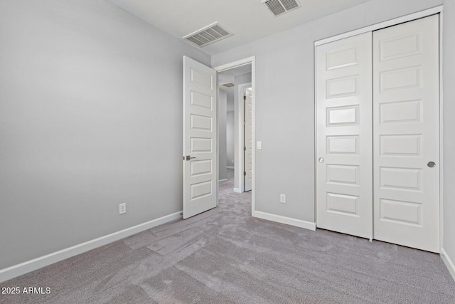 21047 N 58th Way, Phoenix, AZ 85054 - unfurnished bedroom with carpet flooring, baseboards, and a closet