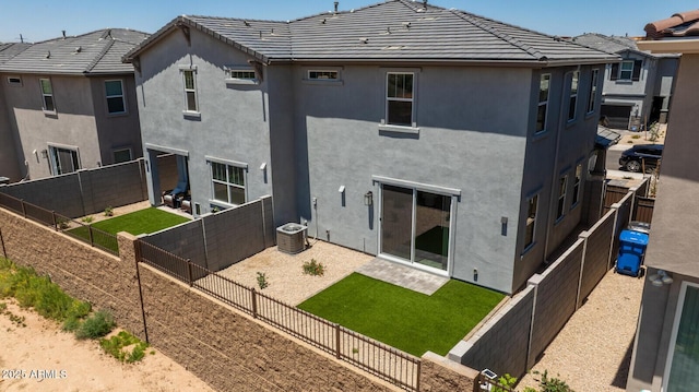 21047 N 58th Way, Phoenix, AZ 85054 - rear view of house with stucco siding, a fenced backyard, a tiled roof, and cooling unit