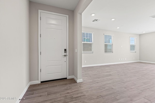 21047 N 58th Way, Phoenix, AZ 85054 - entryway with wood finished floors, baseboards, and recessed lighting