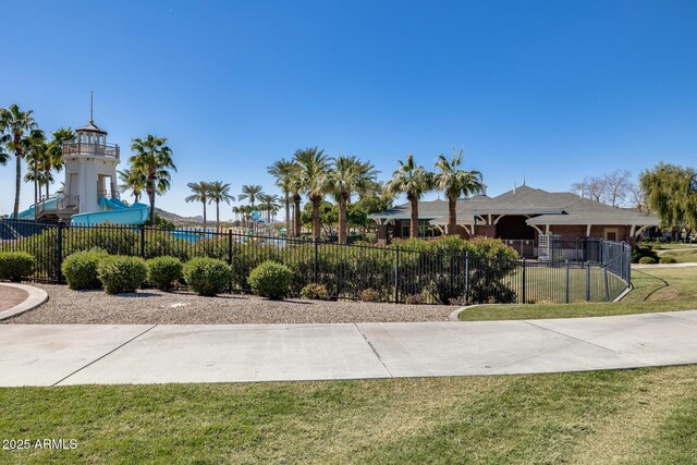 18103 W Canyon Ln, Goodyear, AZ 85338 - view of home's community with a lawn and fence