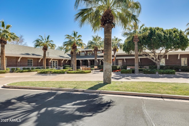 18103 W Canyon Ln, Goodyear, AZ 85338 - view of front of house featuring brick siding and a front yard
