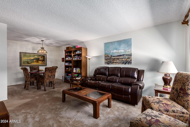 carpeted living room featuring a textured ceiling