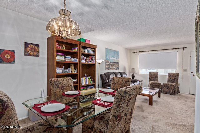 carpeted dining area featuring a chandelier and a textured ceiling