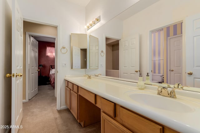 bathroom with toilet and vanity