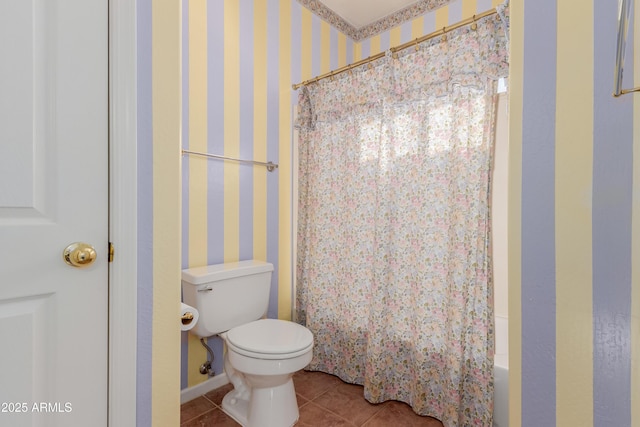 bathroom featuring toilet and tile patterned floors