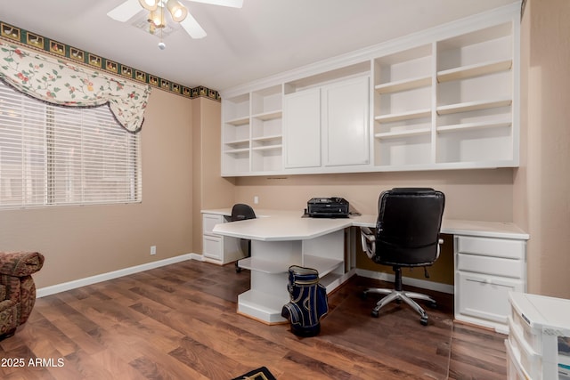 office space featuring ceiling fan and dark hardwood / wood-style flooring