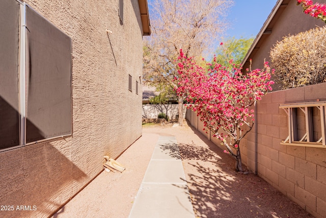 view of side of home with a patio area