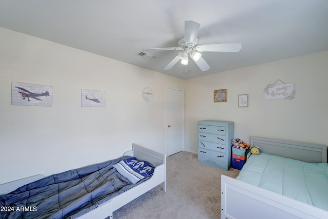 carpeted bedroom featuring ceiling fan