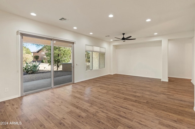 spare room with wood-type flooring and ceiling fan