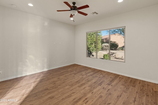 unfurnished room featuring a ceiling fan, recessed lighting, visible vents, and wood finished floors