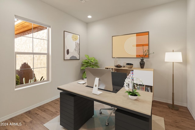 office featuring recessed lighting, wood finished floors, and baseboards