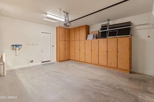 garage featuring baseboards and a garage door opener