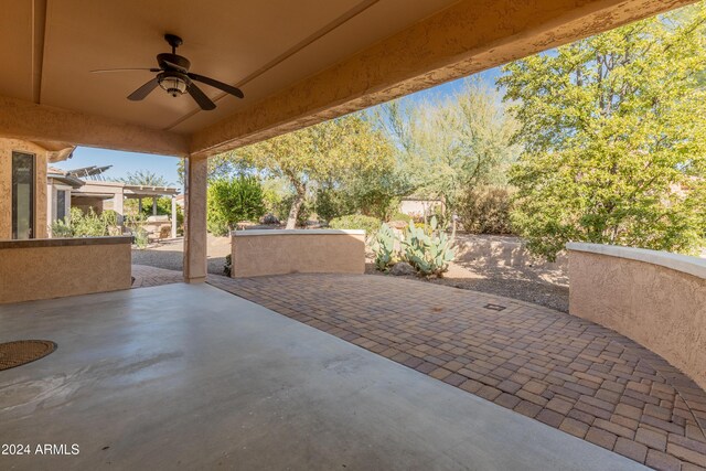 view of patio featuring ceiling fan and a pergola