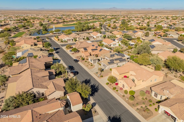 birds eye view of property featuring a water view and a residential view