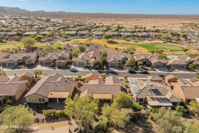 drone / aerial view with golf course view and a residential view