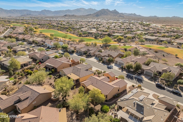 aerial view featuring a residential view, view of golf course, and a mountain view