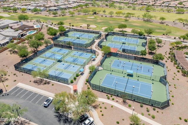 drone / aerial view featuring golf course view and a residential view