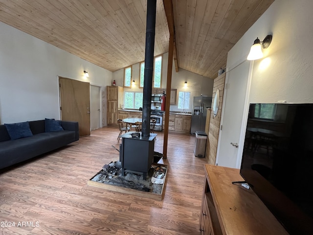 living room with high vaulted ceiling, wood-type flooring, a wood stove, and wood ceiling