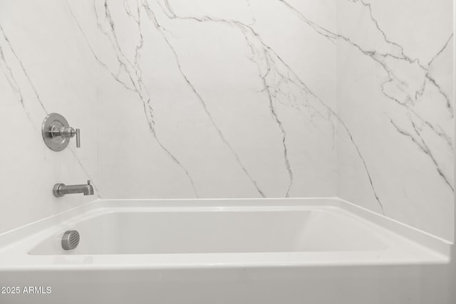 bathroom featuring a bathtub