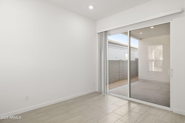 unfurnished bedroom featuring recessed lighting, baseboards, and access to outside