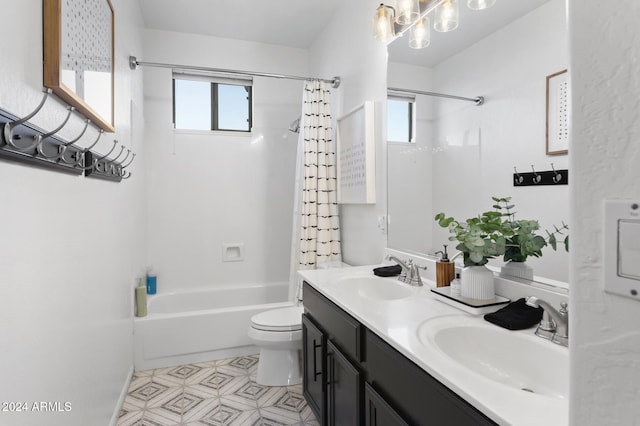 full bathroom with vanity, toilet, and shower / tub combo