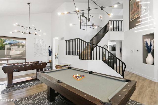 recreation room featuring high vaulted ceiling, pool table, and wood-type flooring