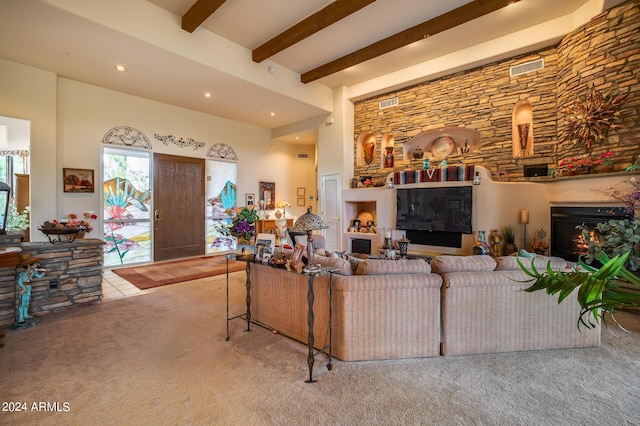 living room with light carpet and beam ceiling