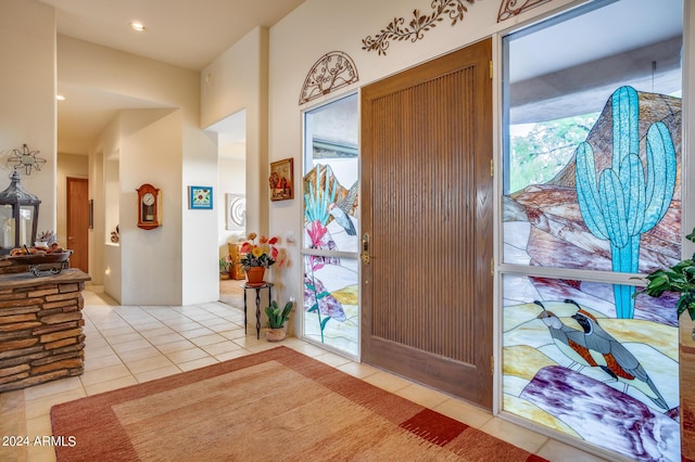 foyer entrance featuring light tile patterned flooring