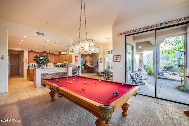 recreation room with light colored carpet and pool table