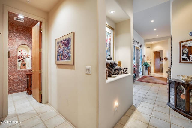 hallway with light tile patterned floors