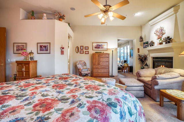 bedroom with ceiling fan and light carpet