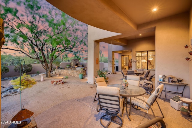 view of patio terrace at dusk