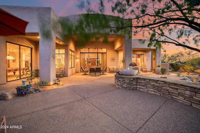 patio terrace at dusk with outdoor lounge area