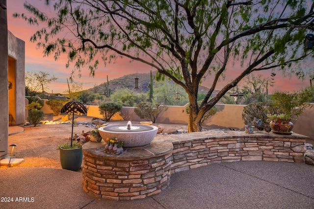 view of patio terrace at dusk