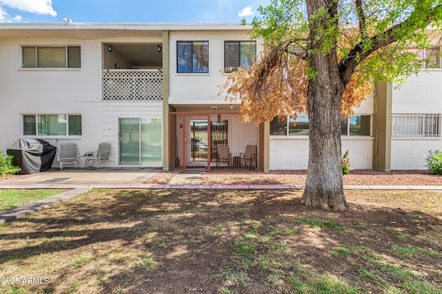 920 N 82nd St Unit H103, Scottsdale, AZ 85257 - rear view of property with a patio
