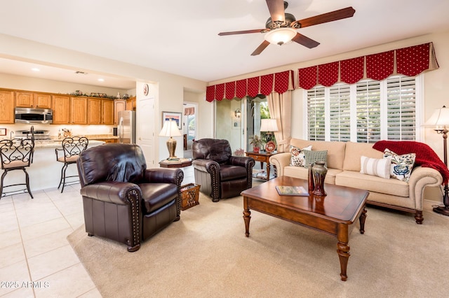 living area with light tile patterned floors, ceiling fan, recessed lighting, and a healthy amount of sunlight