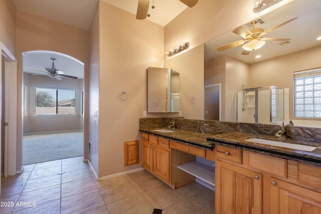 bathroom featuring vanity, tile patterned floors, ceiling fan, and walk in shower