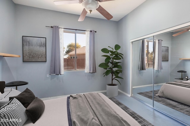 bedroom featuring ceiling fan and a closet