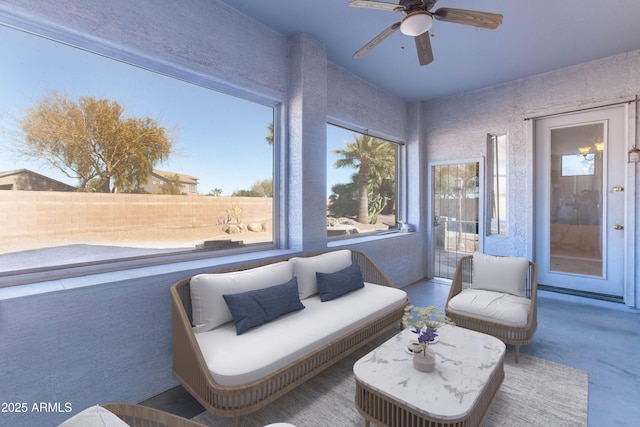 sunroom / solarium with ceiling fan