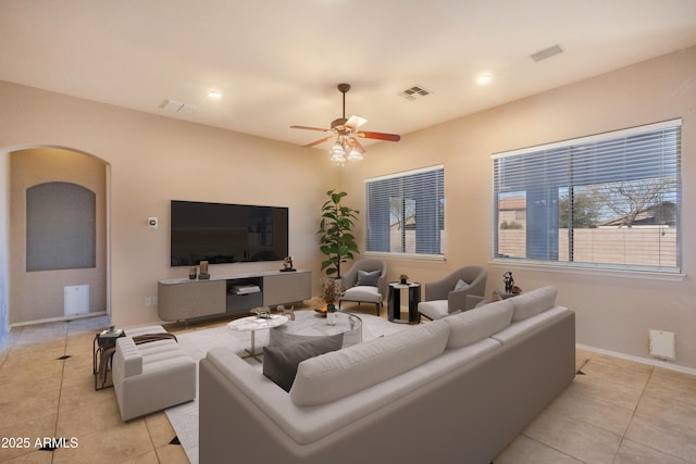 living room featuring ceiling fan and light tile patterned floors