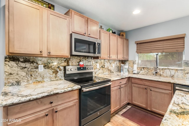 4321 E Morenci Rd, San Tan Valley, AZ 85143 - kitchen with appliances with stainless steel finishes, light brown cabinetry, backsplash, and recessed lighting