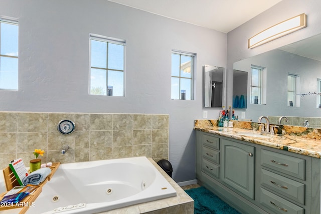 4321 E Morenci Rd, San Tan Valley, AZ 85143 - full bathroom with vanity, healthy amount of natural light, a jetted tub, and baseboards