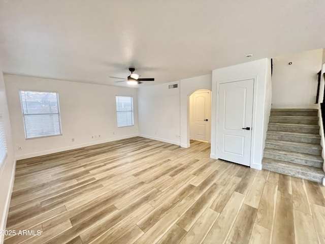 spare room featuring light hardwood / wood-style flooring and ceiling fan