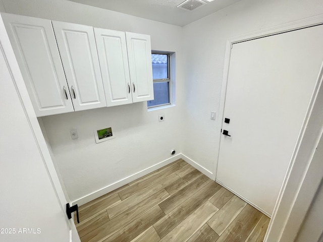 laundry room with washer hookup, cabinets, hookup for an electric dryer, and light wood-type flooring