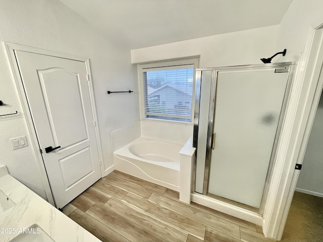 bathroom with vanity and independent shower and bath