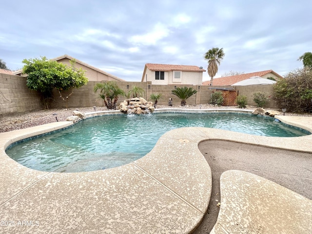 view of swimming pool featuring pool water feature