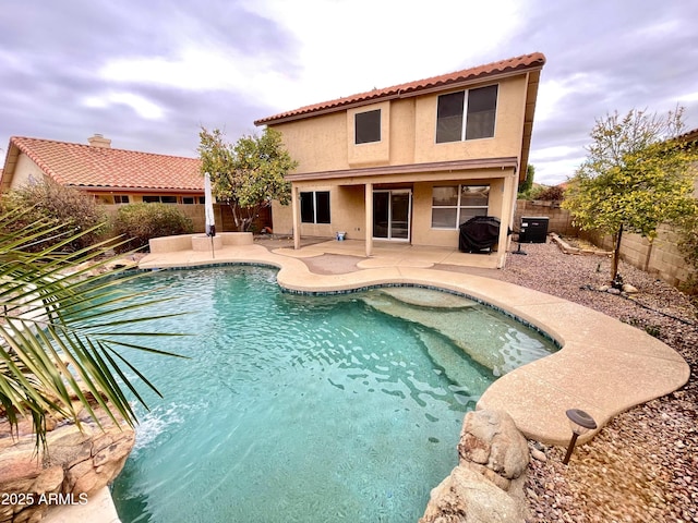 view of pool featuring a patio and central AC unit