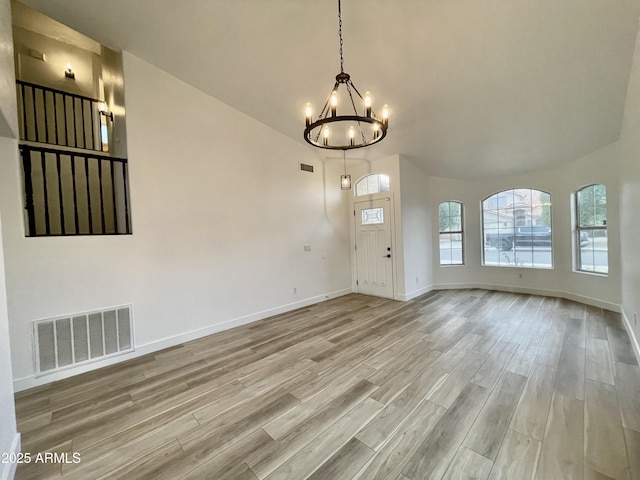 interior space featuring a chandelier and light hardwood / wood-style flooring