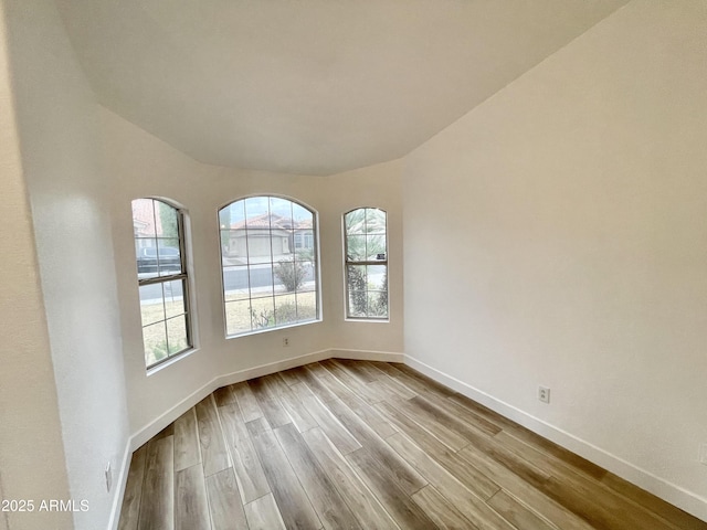 spare room featuring light wood-type flooring