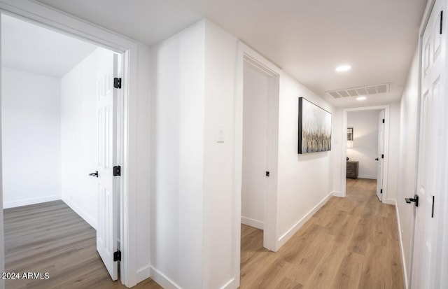 hallway featuring light hardwood / wood-style flooring